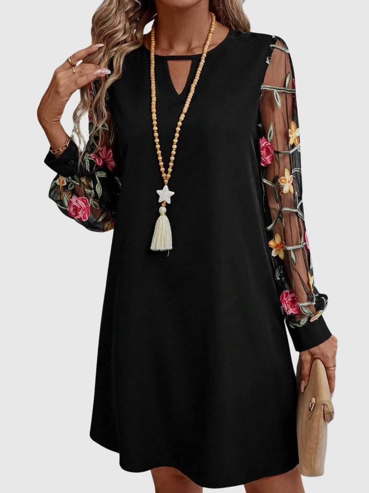 Jolanta | An elegant dress with a V-neck and striking sleeves