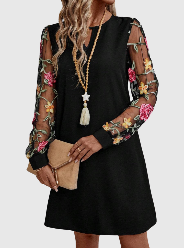 Jolanta | An elegant dress with a V-neck and striking sleeves