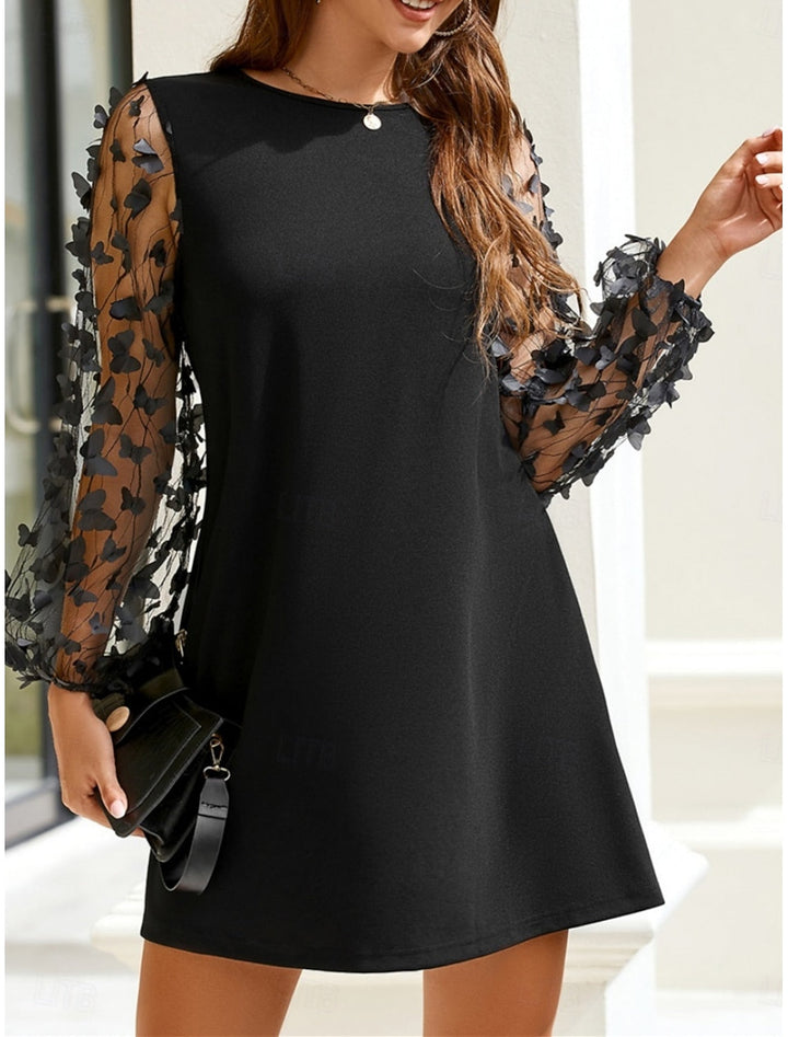 Nela | An elegant black dress with floral tulle sleeves