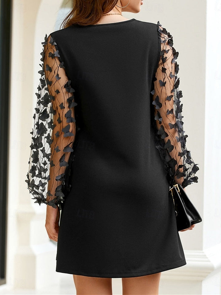 Nela | An elegant black dress with floral tulle sleeves
